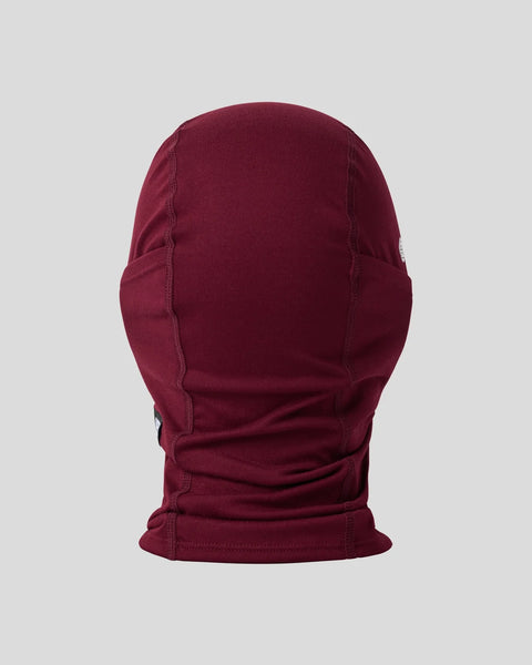 Dark burgundy knit balaclava with seamed construction and ribbed collar, shown flat on neutral background.