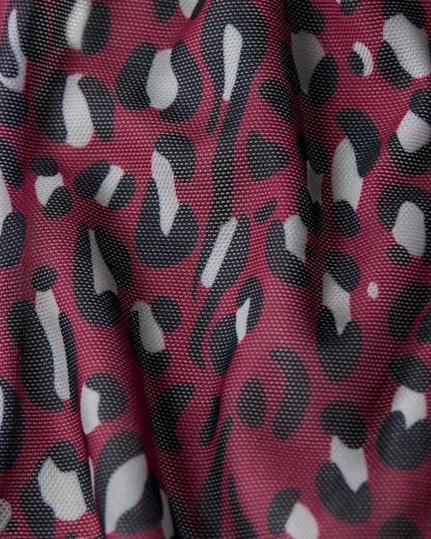 Burgundy mesh fabric with black and white cheetah print pattern.