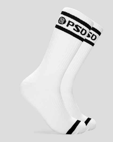 White crew socks with black logo stripe and text at cuff and toe.