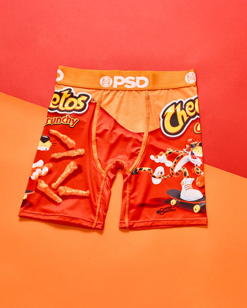 Red Cheetos Crunchy-print boxer briefs with orange waistband and graphic snack imagery on front and back.