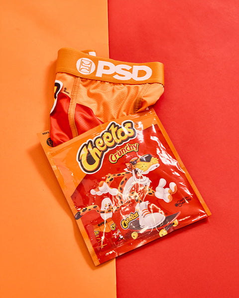 Bag of Cheetos Crunchy with orange PSD waistband on split orange and red background.