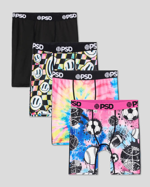Four PSD boxer briefs with elastic waistbands in solid black, checkered smiley face, tie-dye, and sports ball print designs.